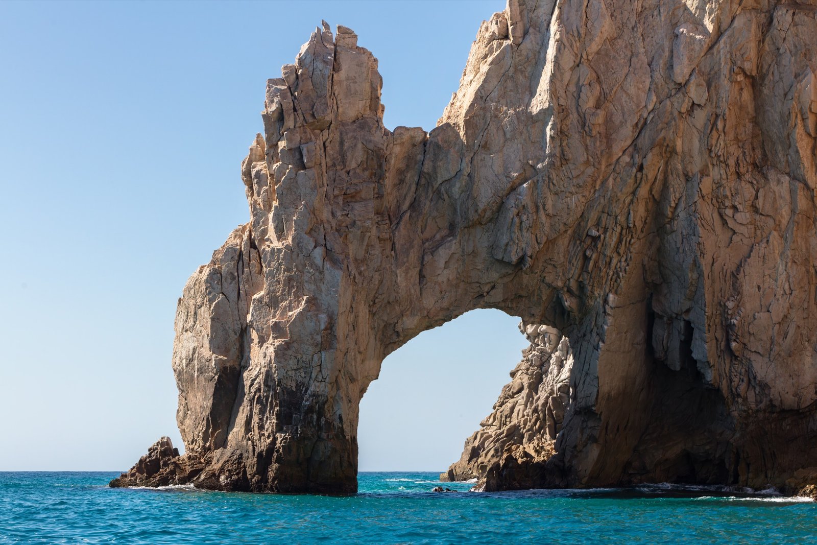 Yacht near El Arco de Cabo San Lucas with snorkelers in the foreground