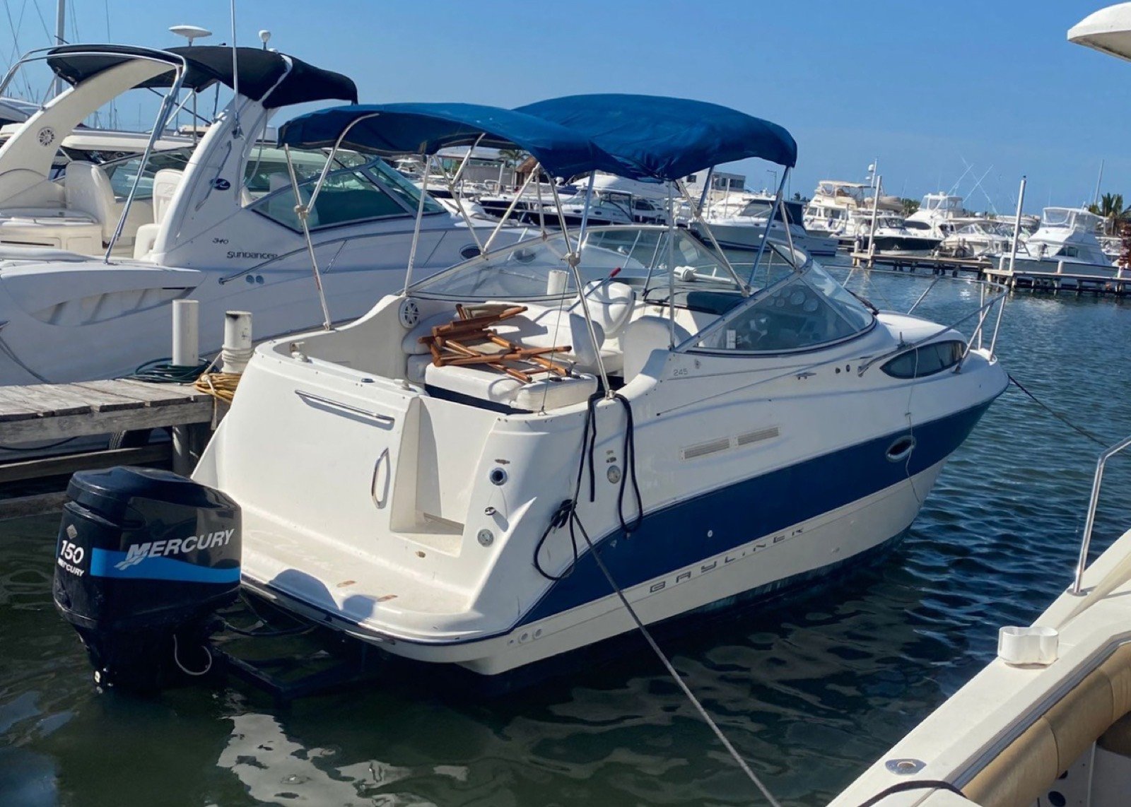 Bayliner 25 ft coastal cruiser moored at Marina Yucalpetén in Progreso Yucatán with Gulf of Mexico visible in the background
