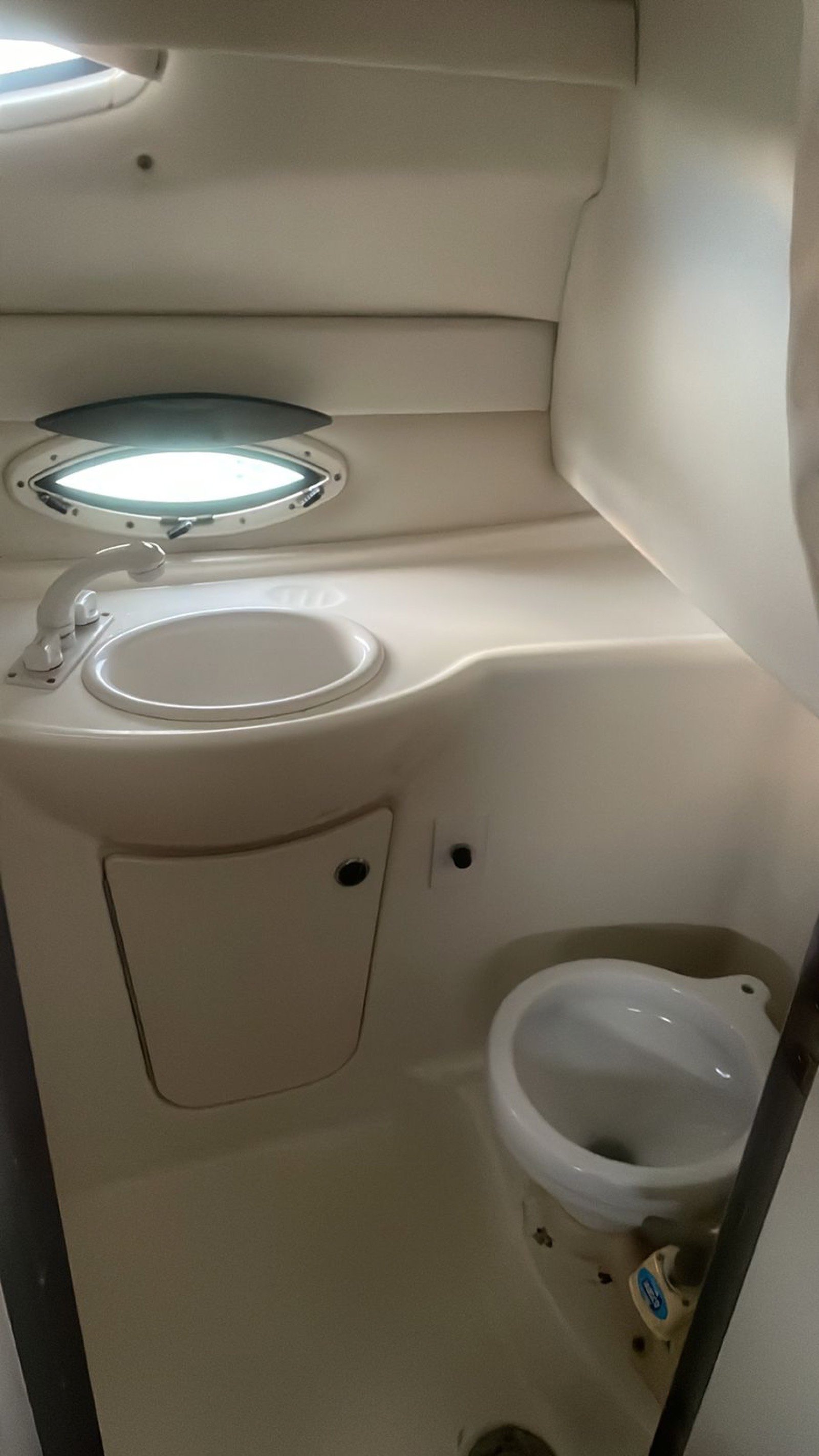 Bayliner 25 ft coastal cruiser moored at Marina Yucalpetén in Progreso Yucatán with Gulf of Mexico visible in the background