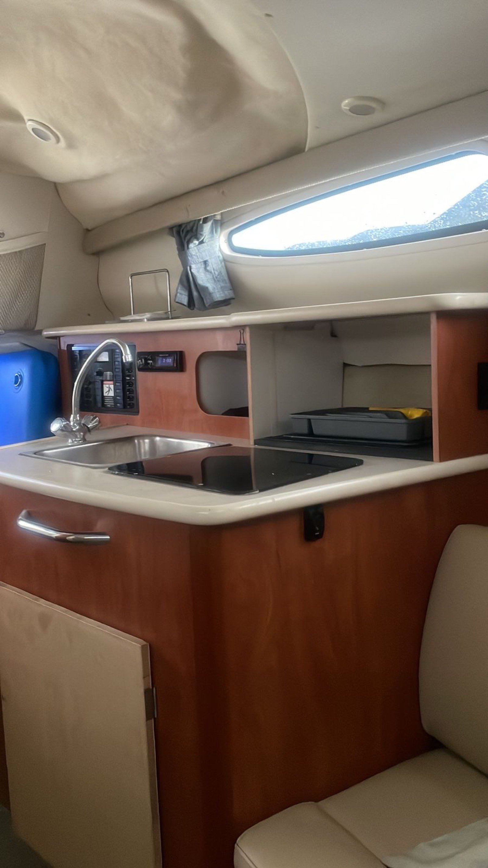 Bayliner 25 ft coastal cruiser moored at Marina Yucalpetén in Progreso Yucatán with Gulf of Mexico visible in the background