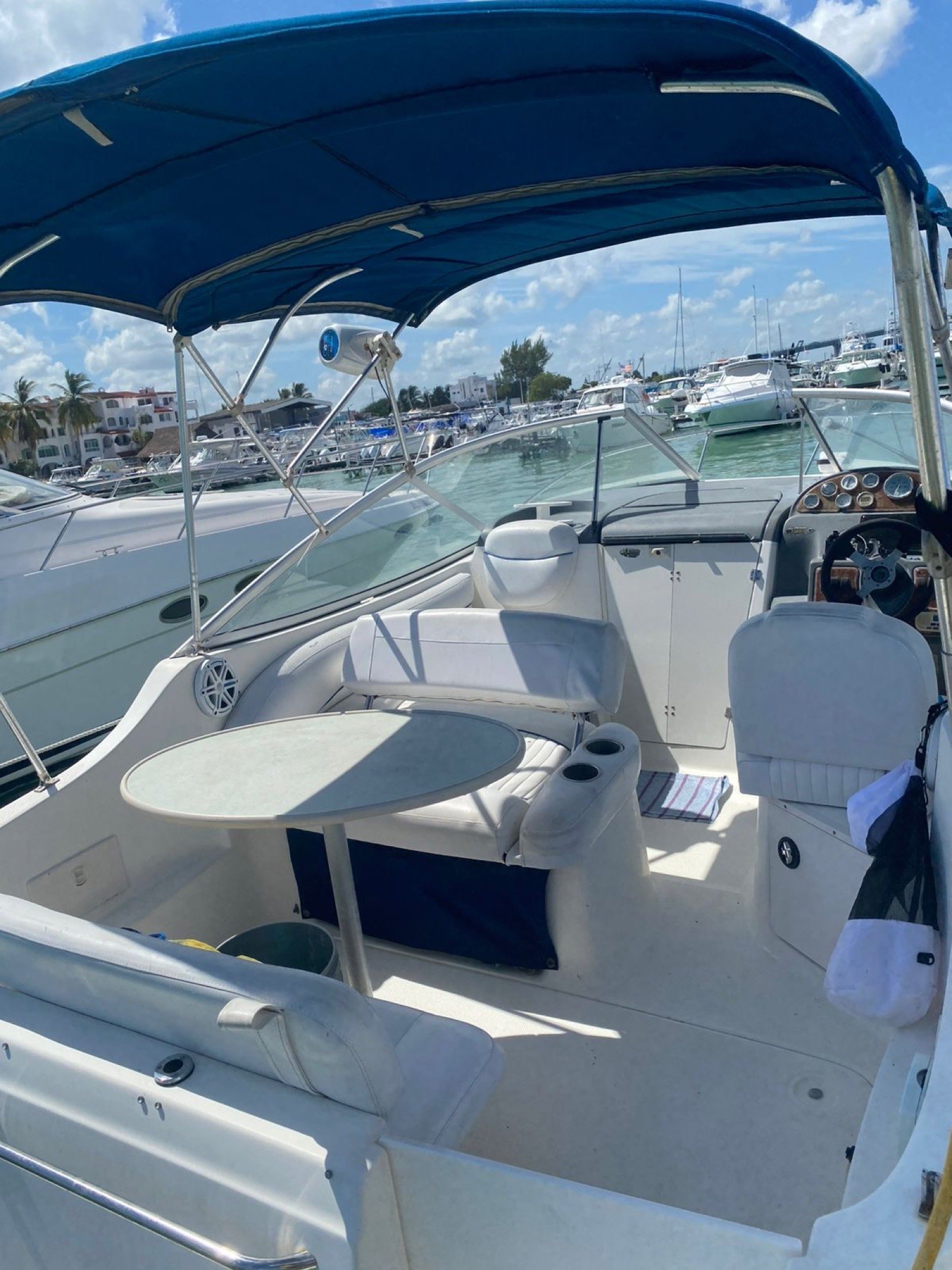 Bayliner 25 ft coastal cruiser moored at Marina Yucalpetén in Progreso Yucatán with Gulf of Mexico visible in the background