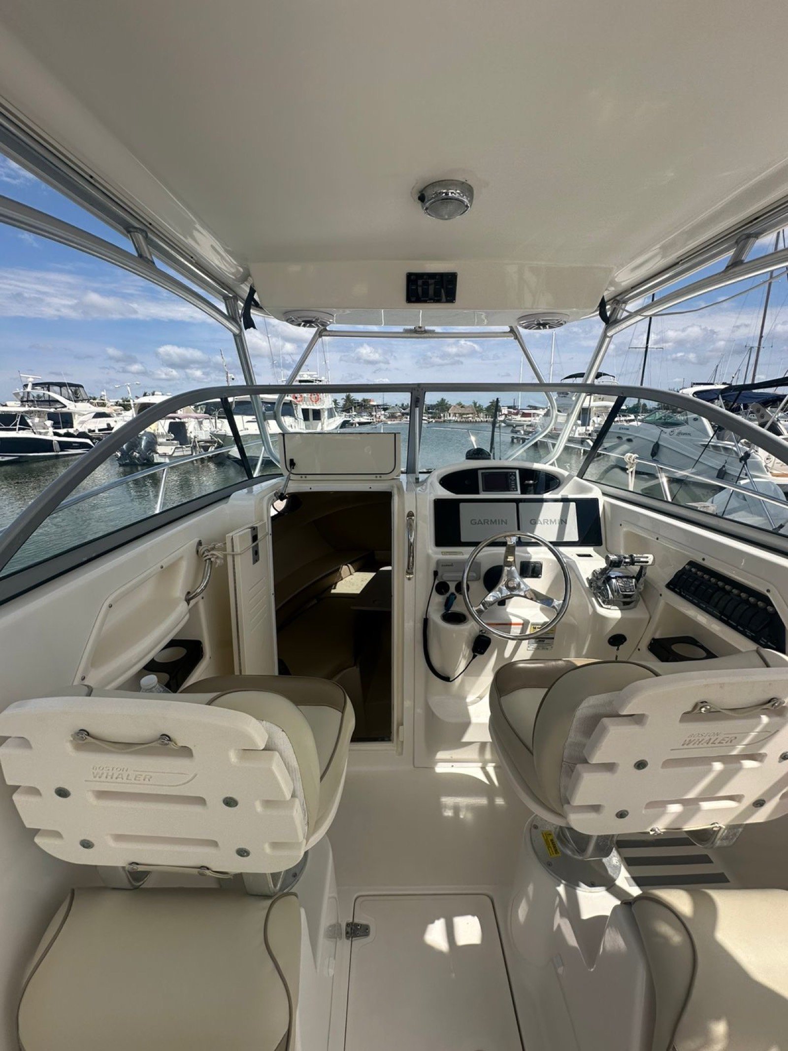 Boston Whaler 30 ft twin-outboard sport-fishing boat at Marina Yucalpetén ready for a charter out of Progreso Yucatán