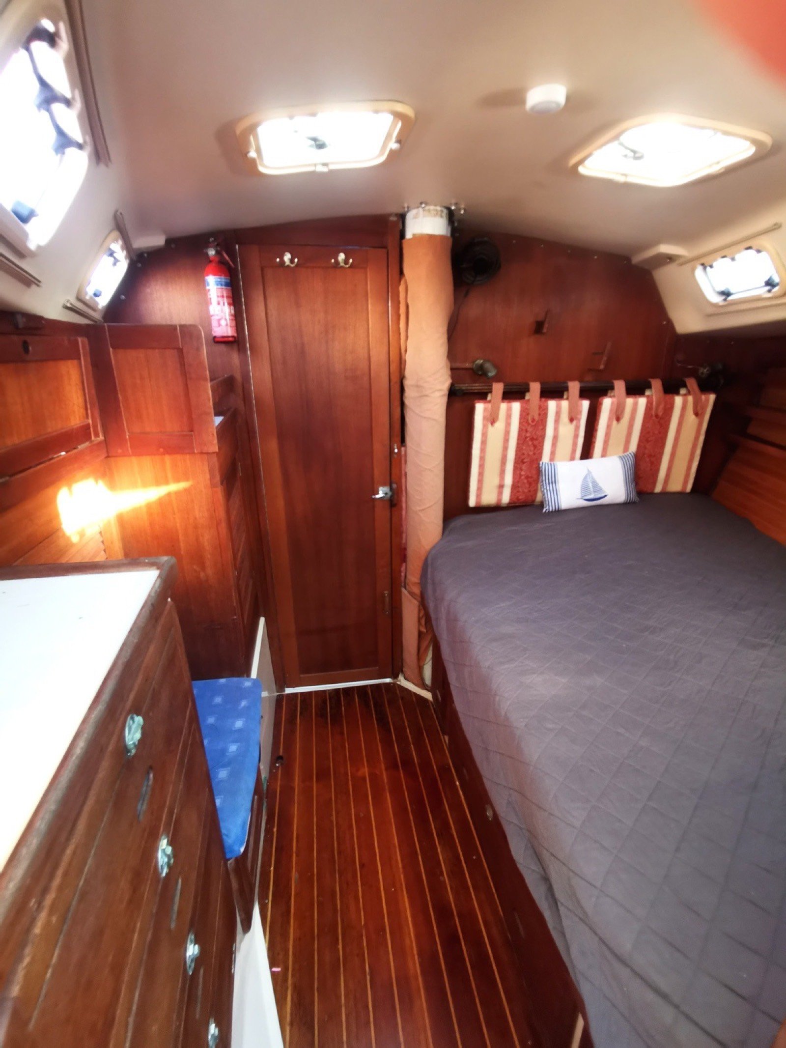 Catalina 42 ft sailing yacht with unfurled white sails off Marina Yucalpetén, Progreso Yucatán