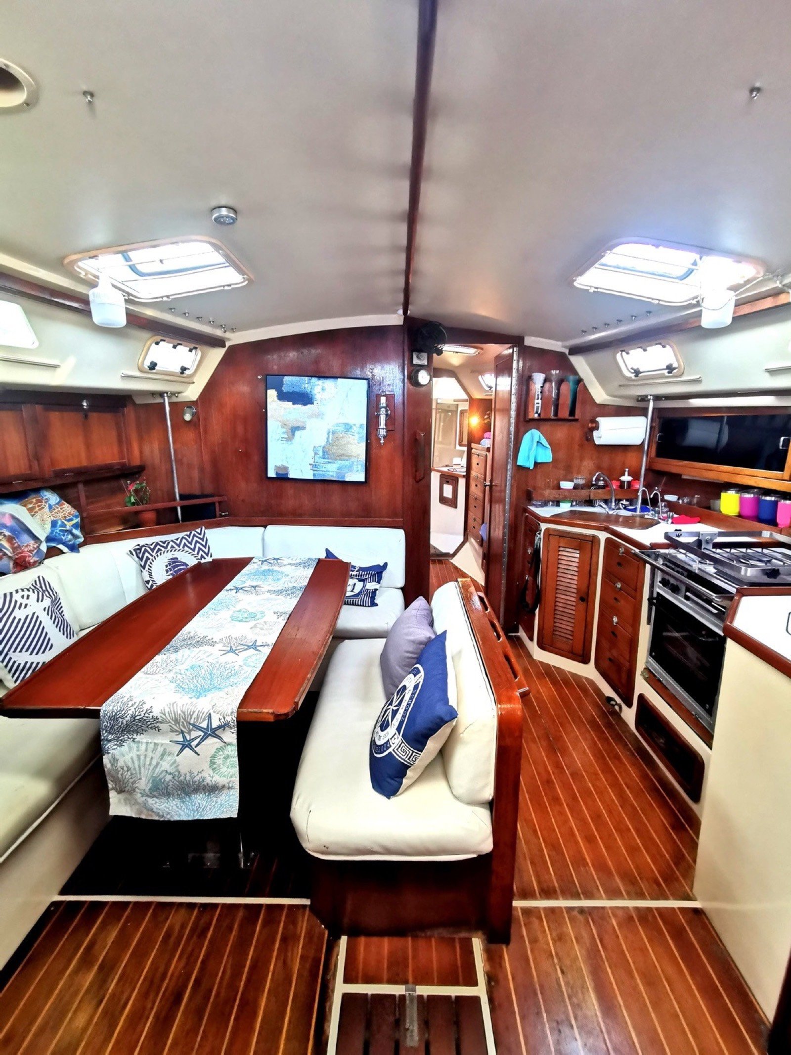 Catalina 42 ft sailing yacht with unfurled white sails off Marina Yucalpetén, Progreso Yucatán