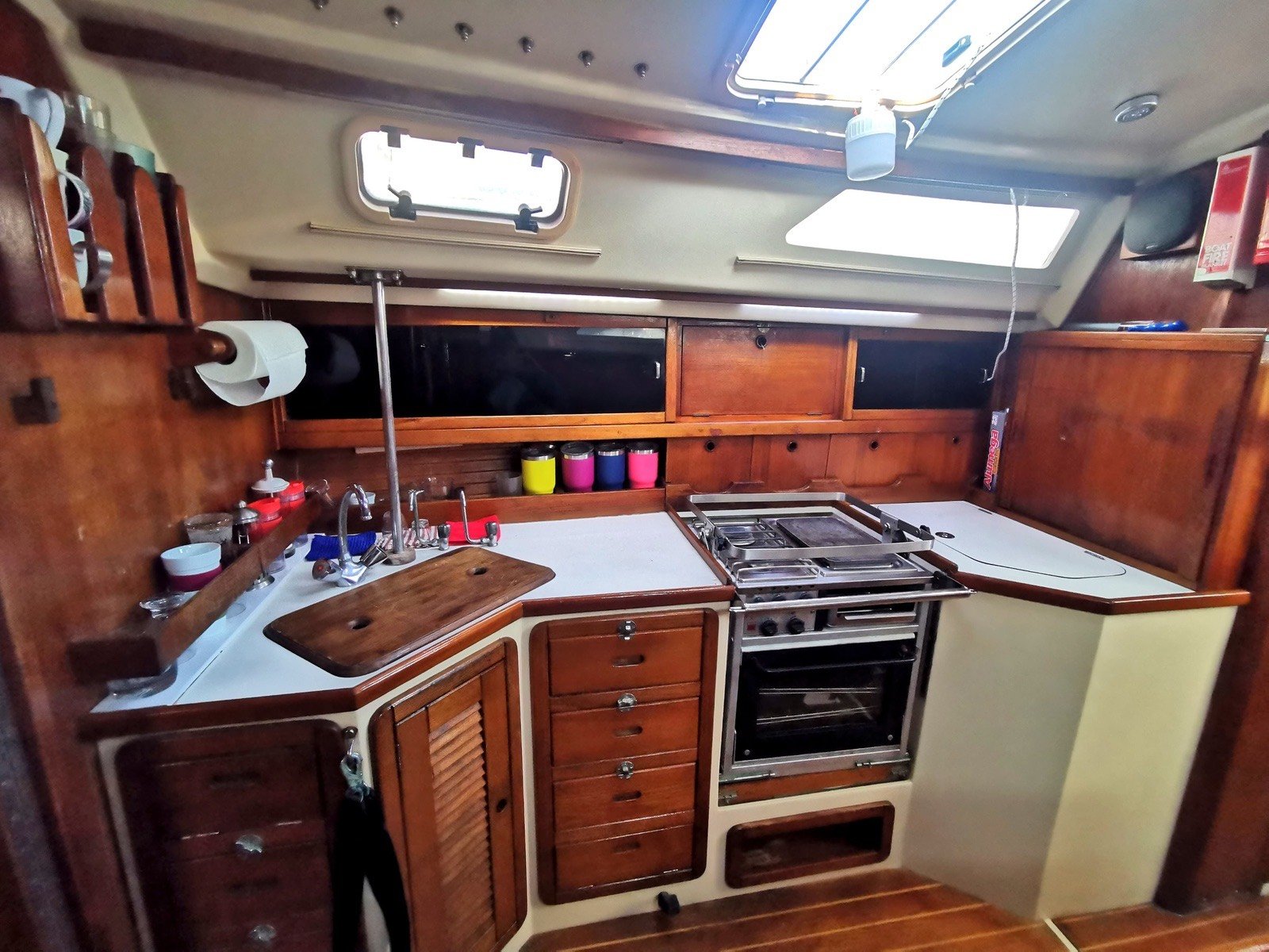 Catalina 42 ft sailing yacht with unfurled white sails off Marina Yucalpetén, Progreso Yucatán