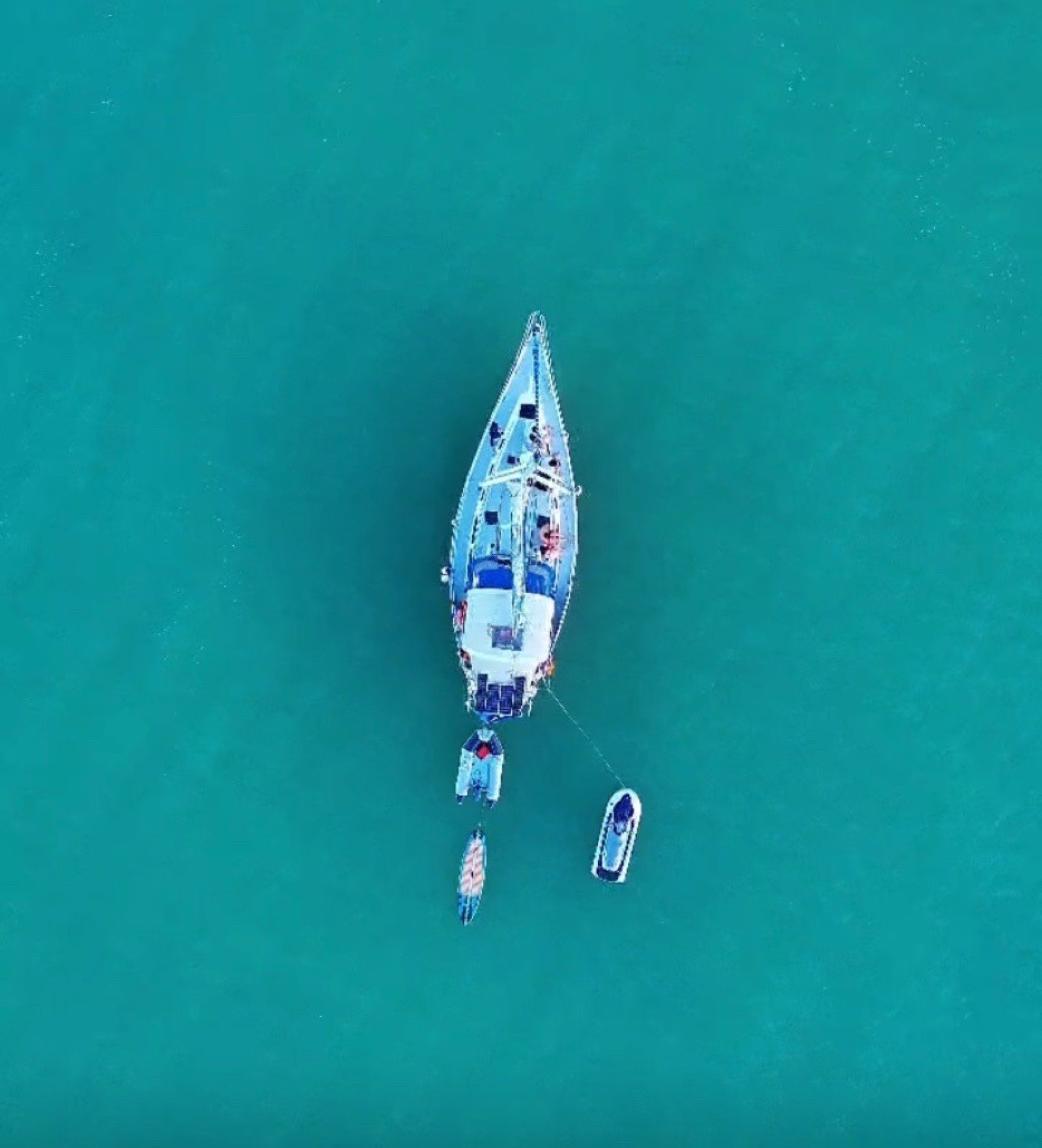 Catalina 42 ft sailing yacht with unfurled white sails off Marina Yucalpetén, Progreso Yucatán