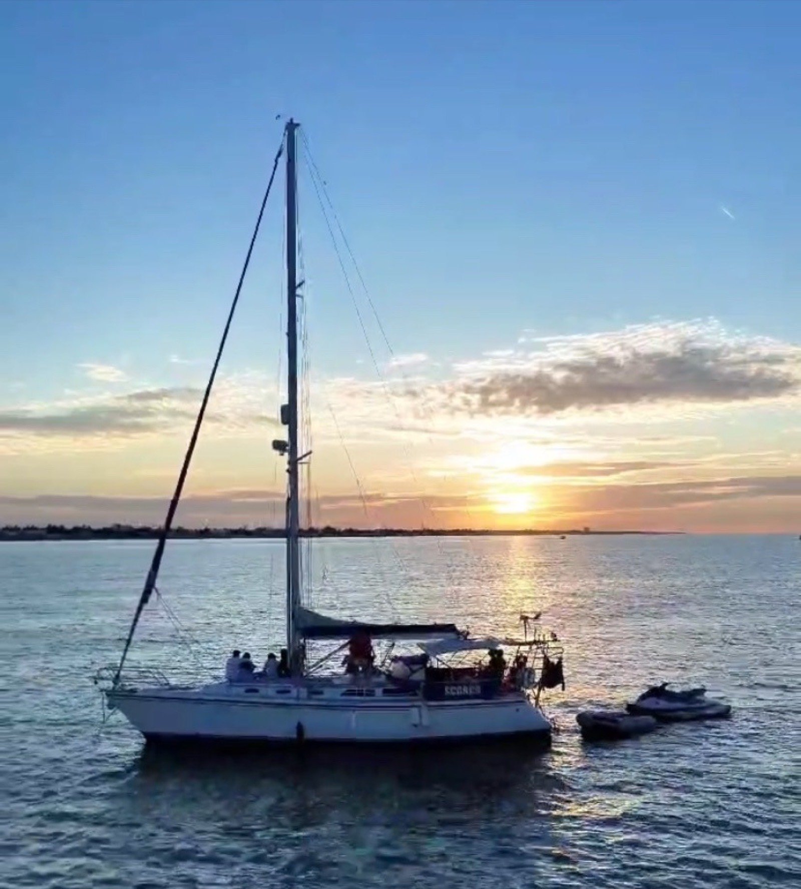 Catalina 42 ft sailing yacht with unfurled white sails off Marina Yucalpetén, Progreso Yucatán