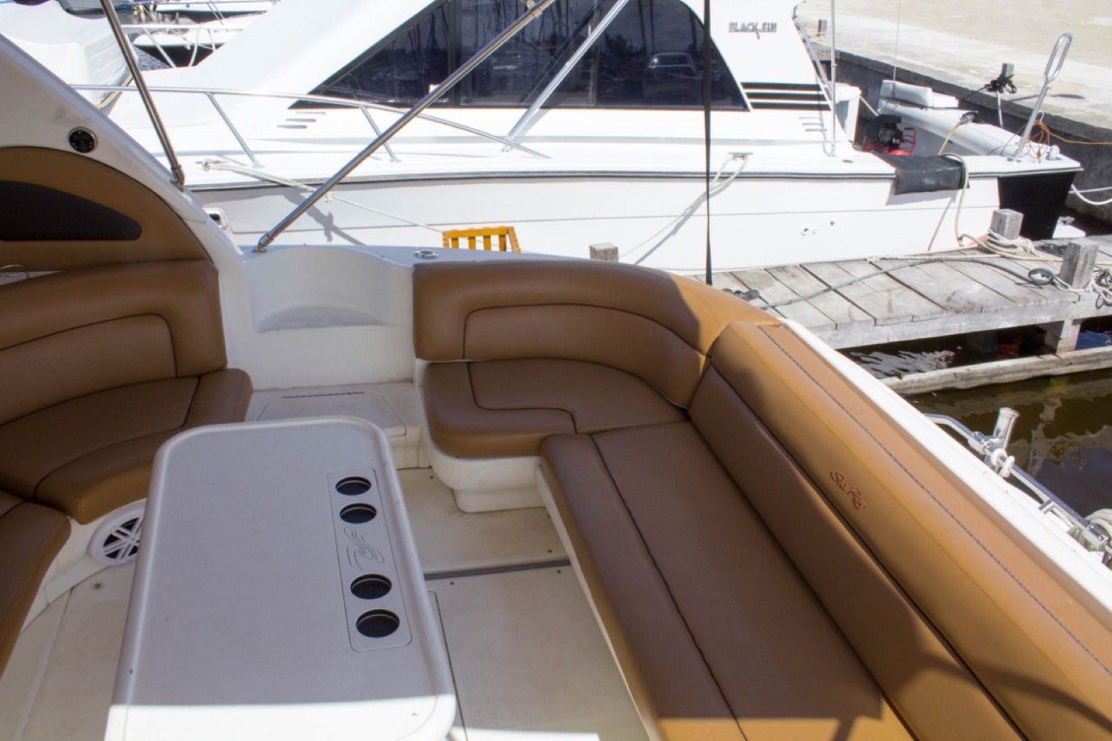 Sea Ray 48 ft Sundancer yacht with large swim platform anchored off Progreso Yucatán for a private charter