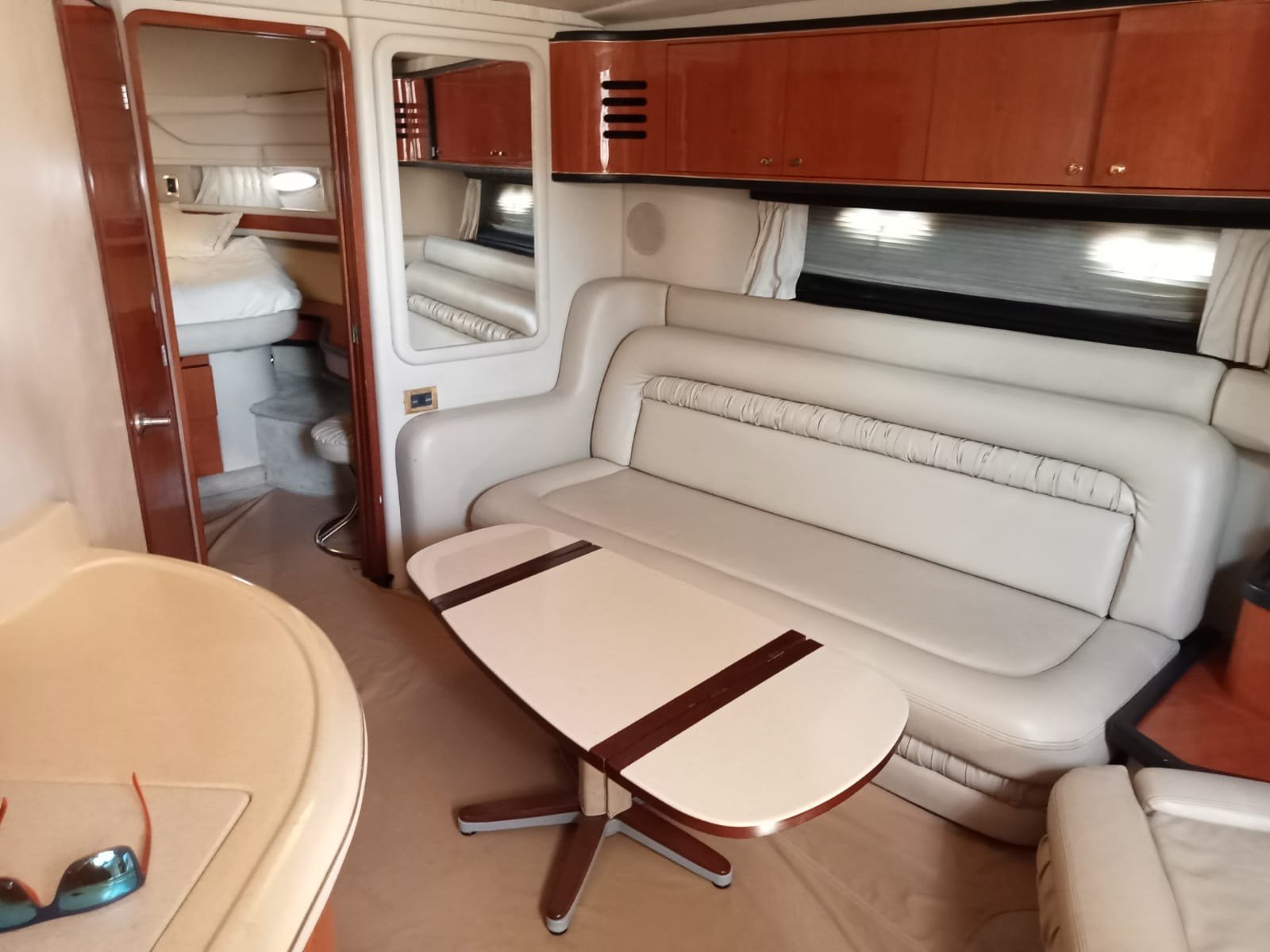 Sea Ray 48 ft Sundancer yacht with large swim platform anchored off Progreso Yucatán for a private charter