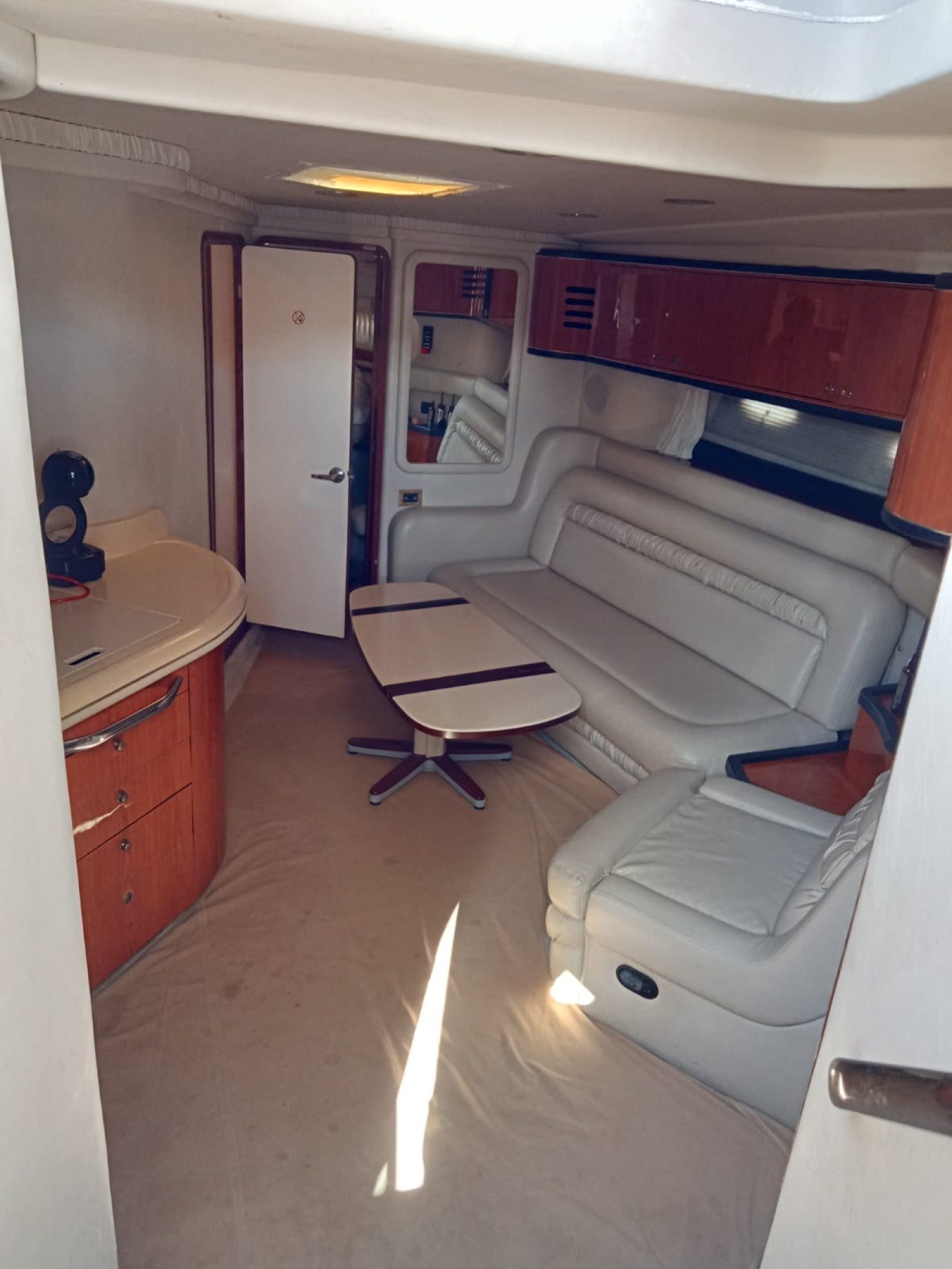 Sea Ray 48 ft Sundancer yacht with large swim platform anchored off Progreso Yucatán for a private charter