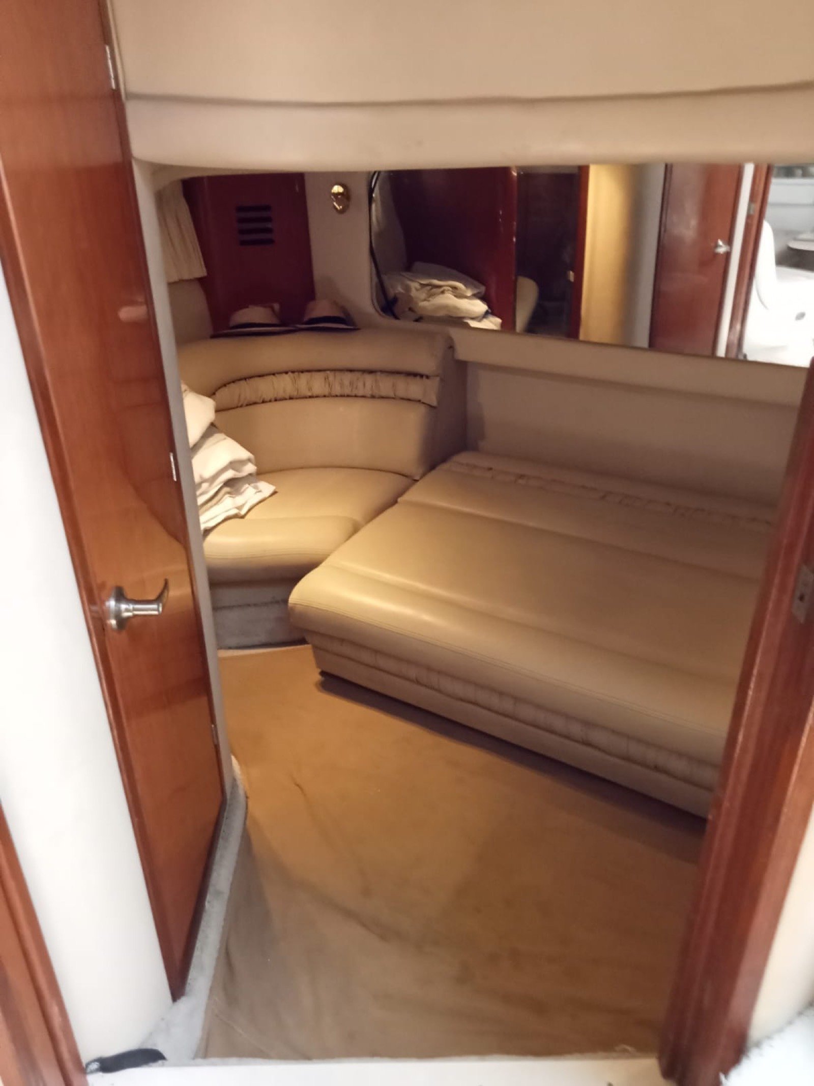 Sea Ray 48 ft Sundancer yacht with large swim platform anchored off Progreso Yucatán for a private charter